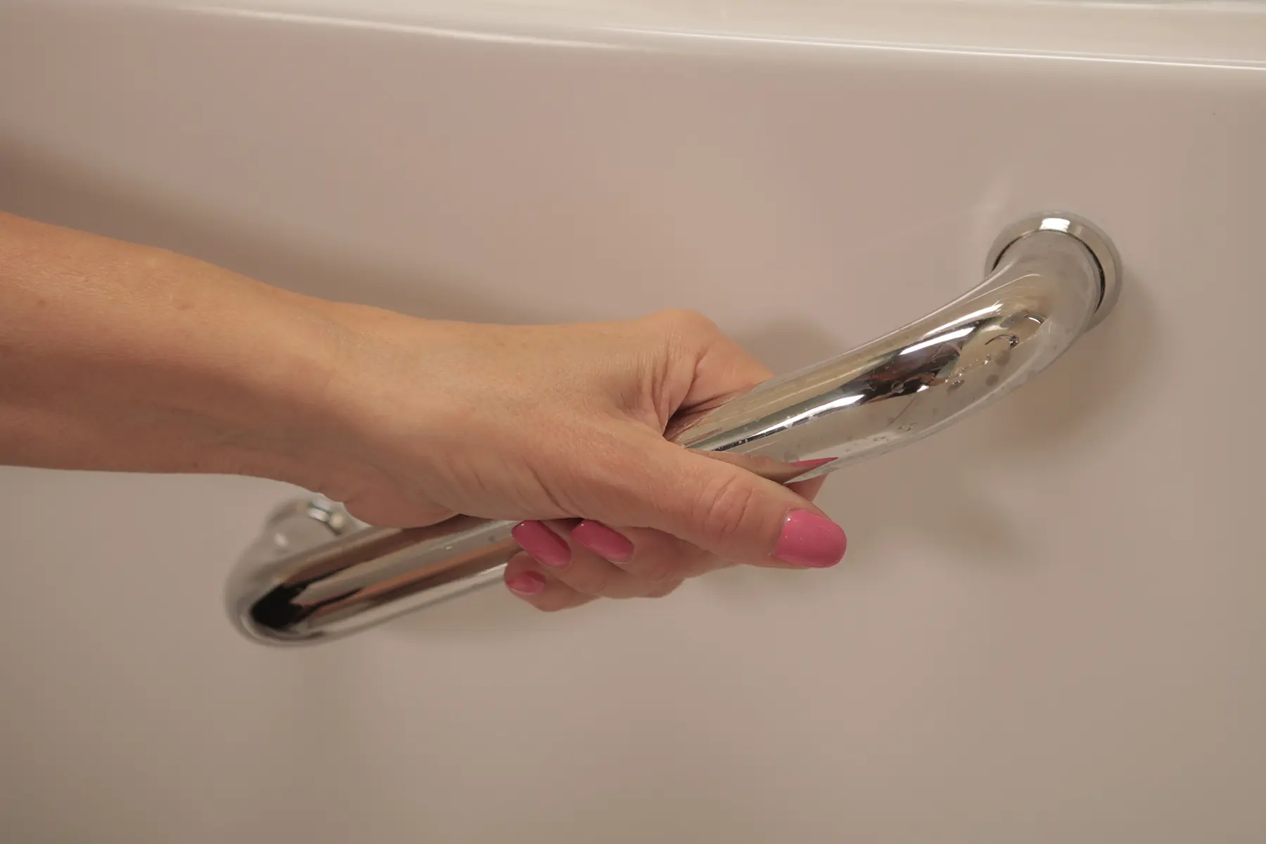 Chrome grab bar on walk-in tub for safe entry and exit
