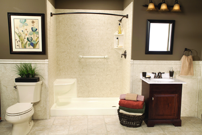 Almond shower base with corner seat and brecchia subway walls in brown bathroom