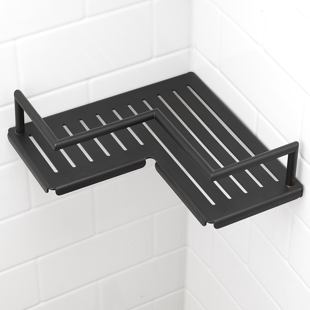 Matte black metal corner shelf on white subway tile